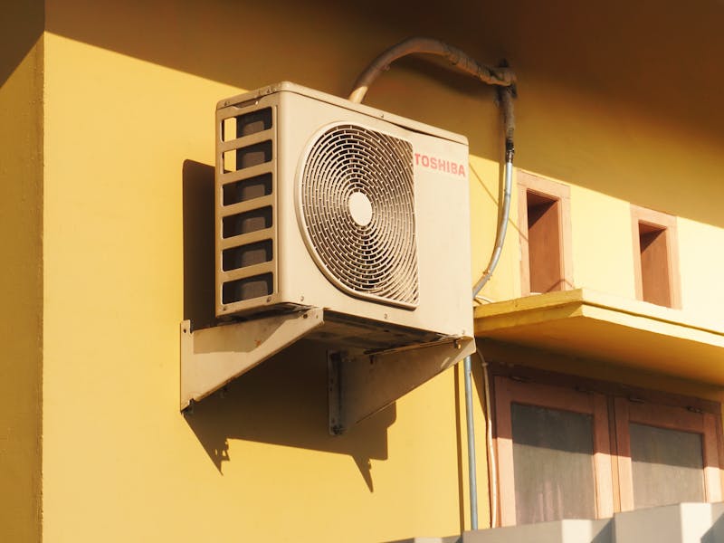 Outdoor air conditioning unit requiring seasonal maintenance